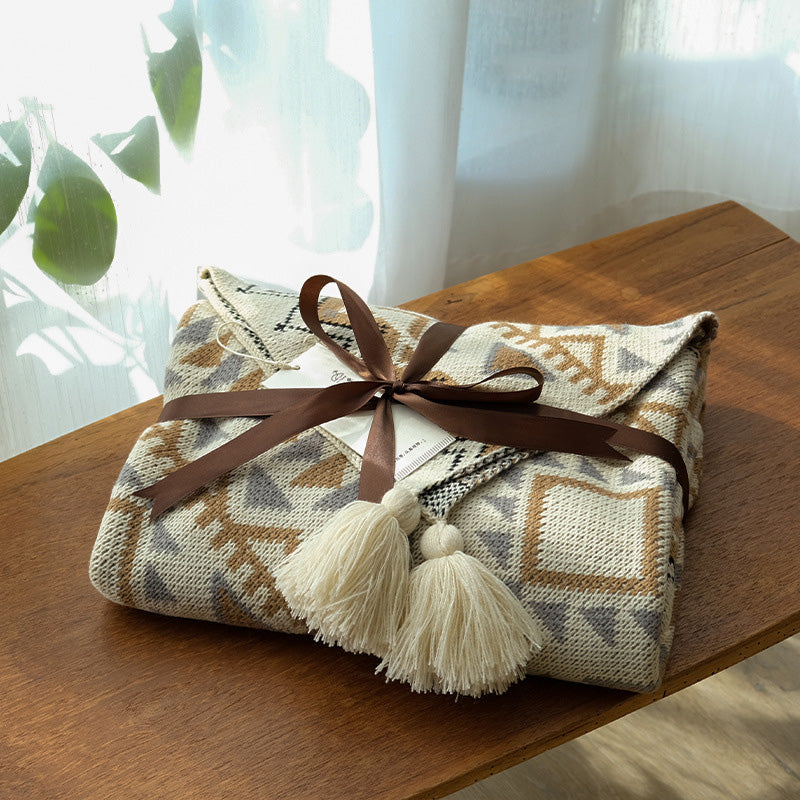 boho acrylic throw blanket with tassels wraped as a gift