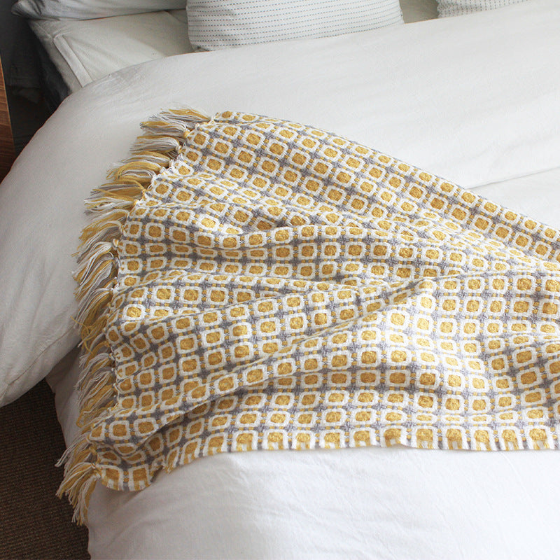 boho throw blanket with tassels on bed