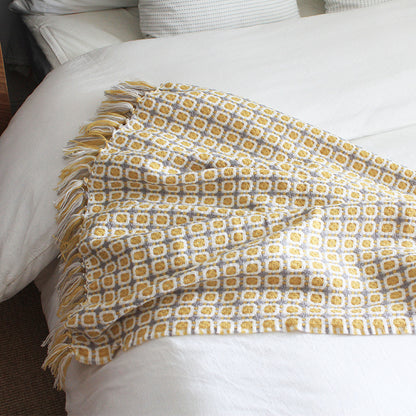 boho throw blanket with tassels on bed