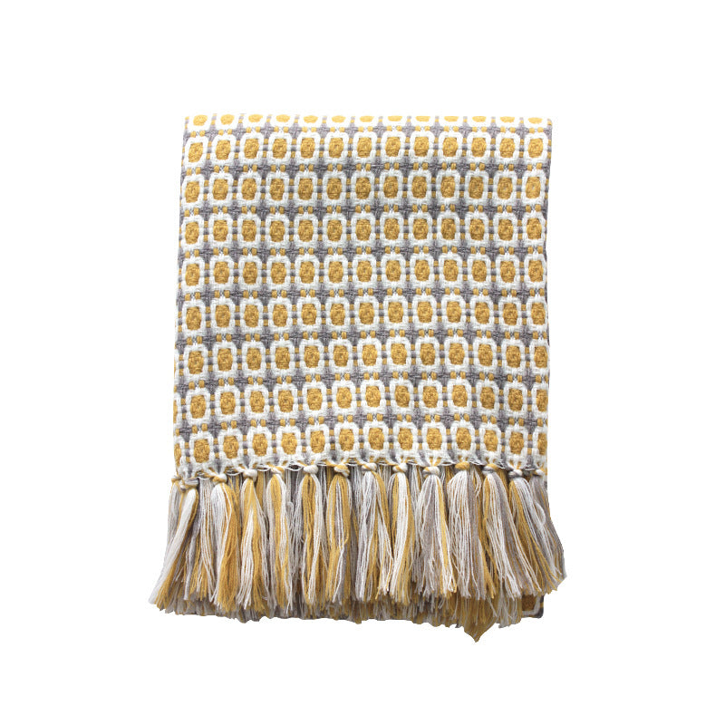 folded boho throw blanket with tassels