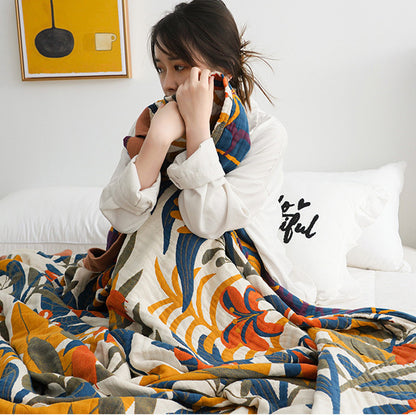 girl covering a colourful  blanket