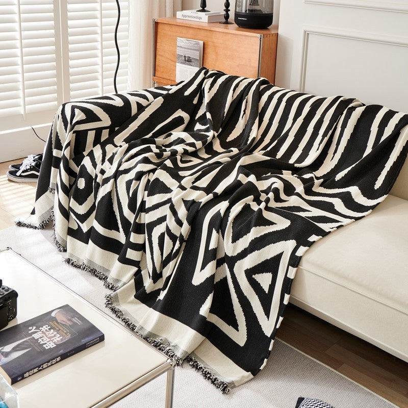 geometric design boho sofa cover in black color on sofa