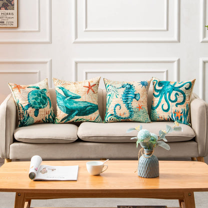 Sofa with decorative pillows featuring sea creatures, a coffee table with a cup and magazine in a living room setting.